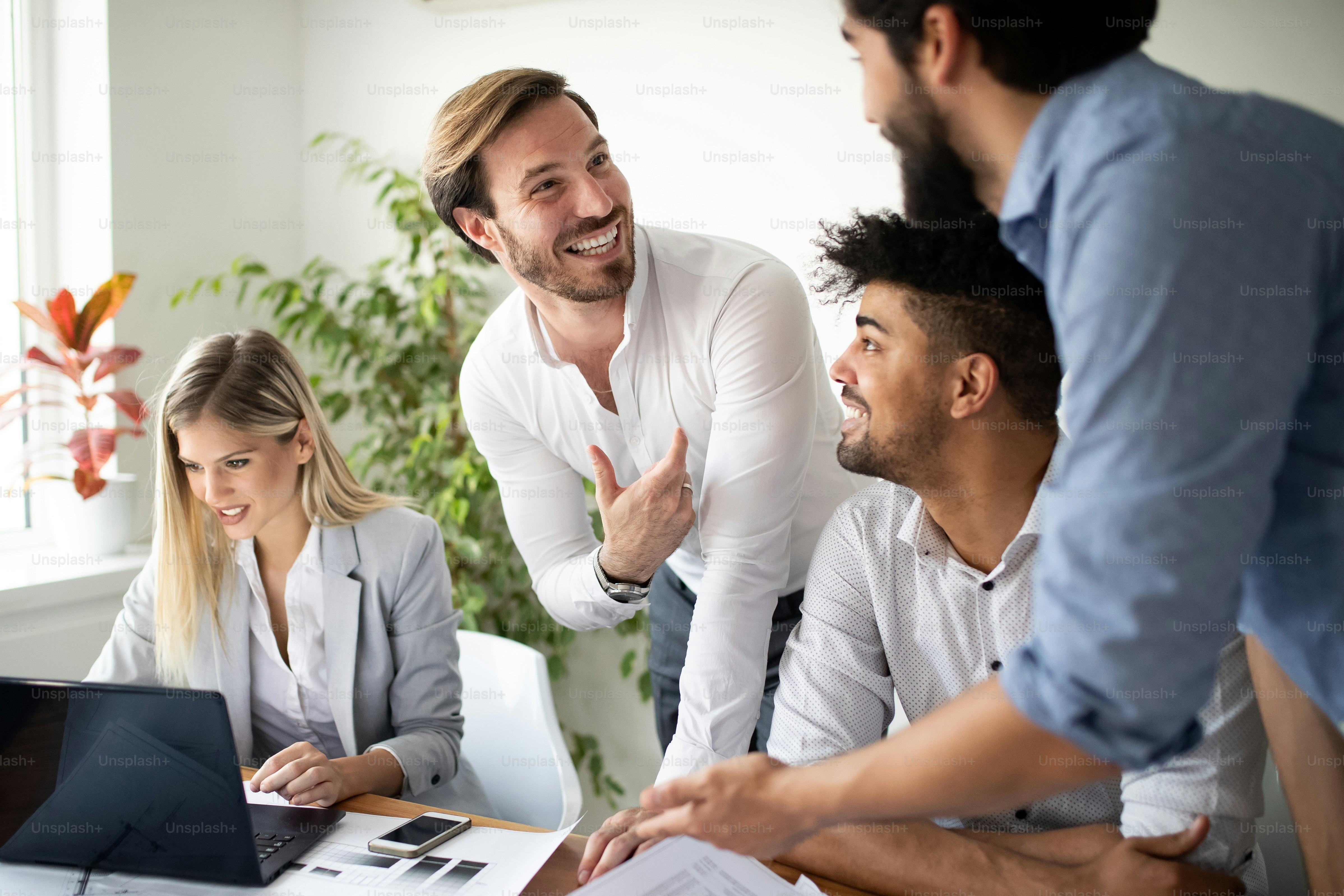Diverse team practicing effective teamwork habits in a meeting