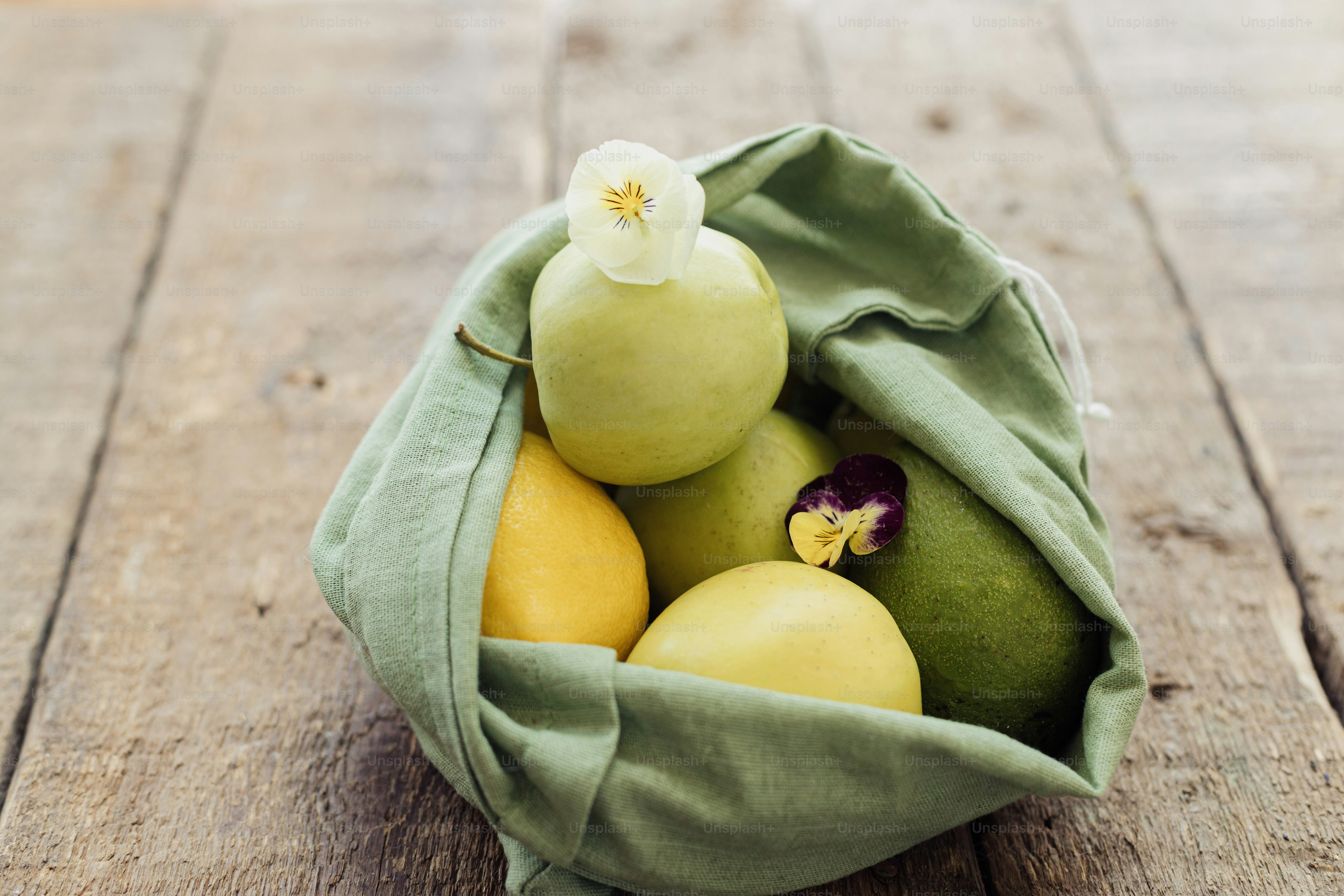 Zero waste shopping. Fresh apples, tomatoes, lemons,avocado and arugula