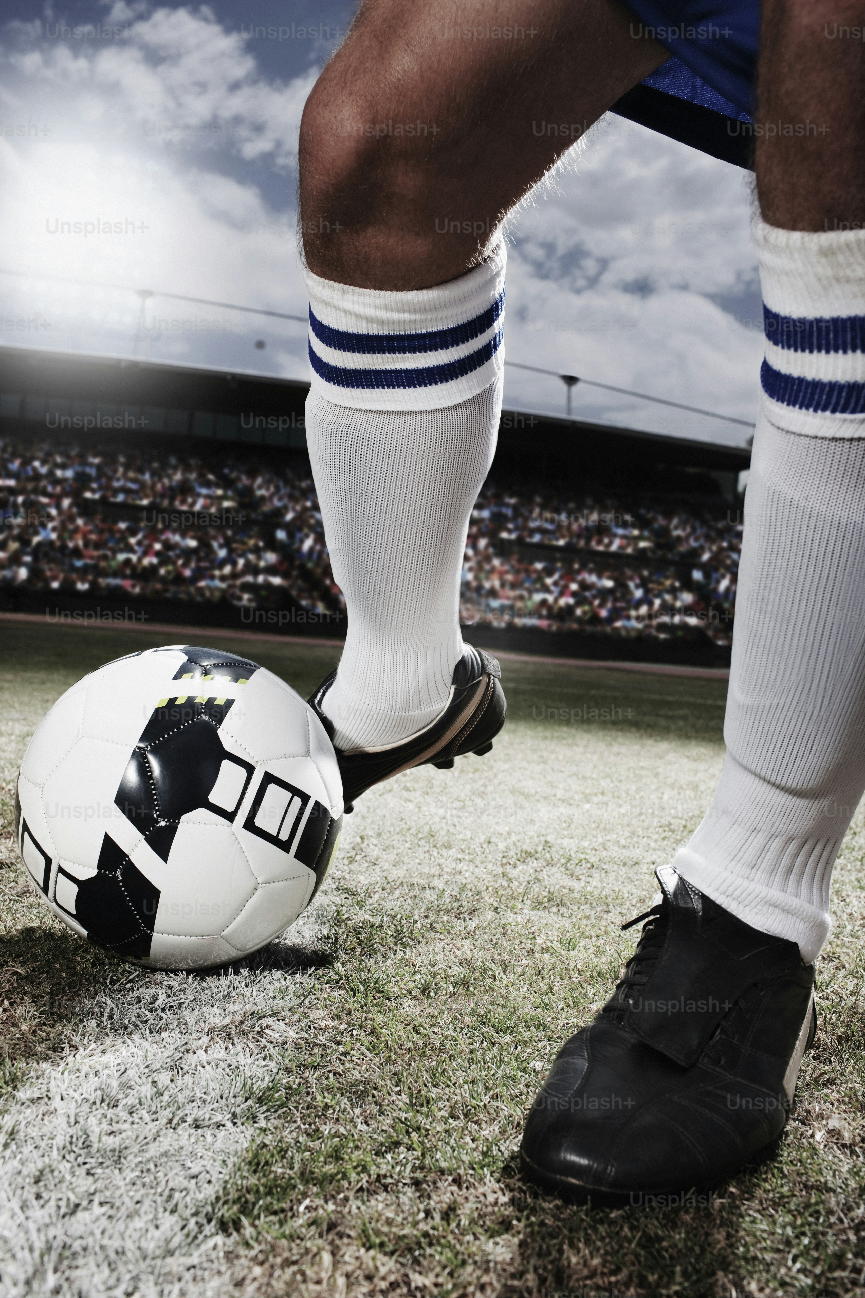 A soccer player with his foot on a soccer ball photo Sports betting