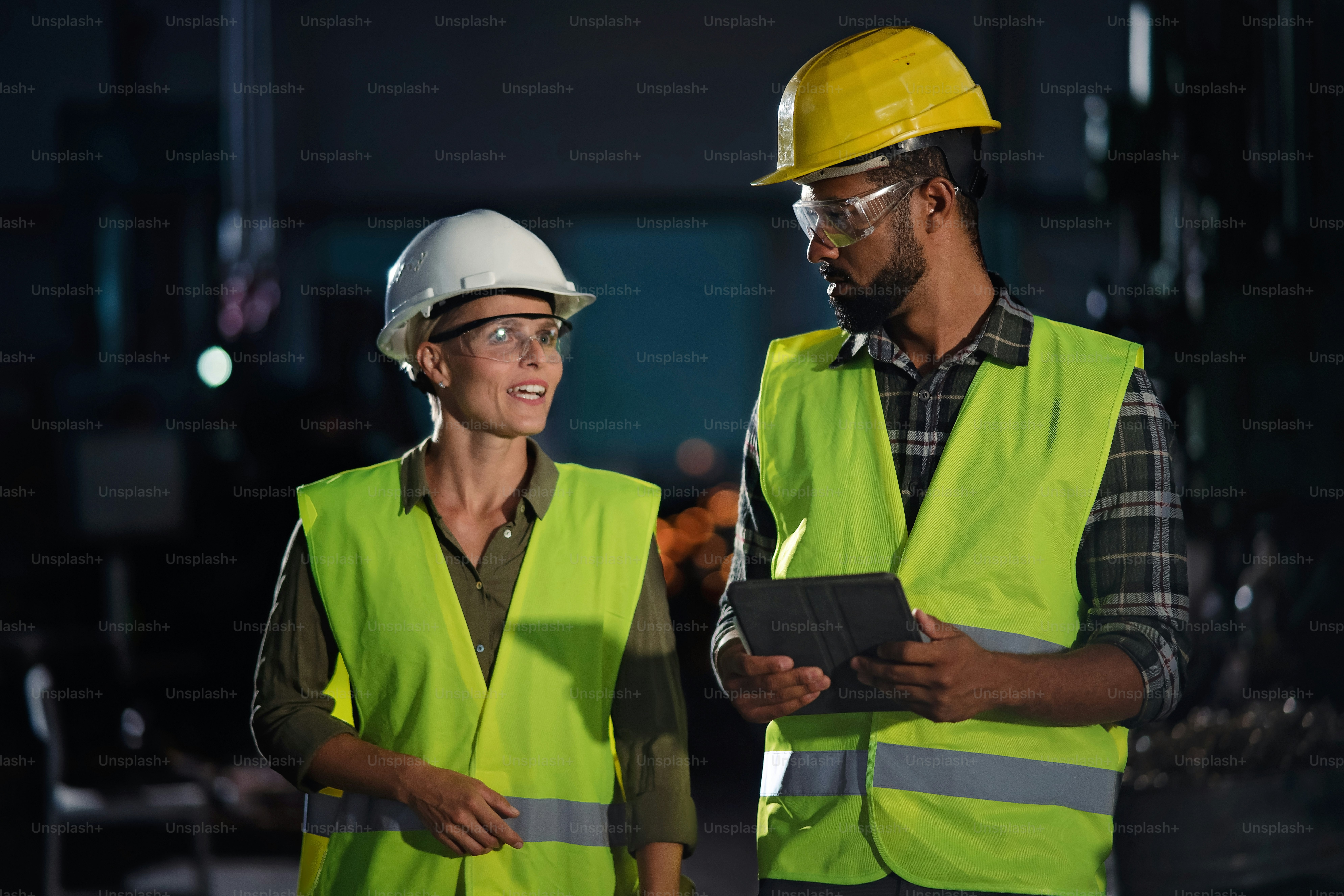 A portrait of industrial inspectors doing a general check up indoors at