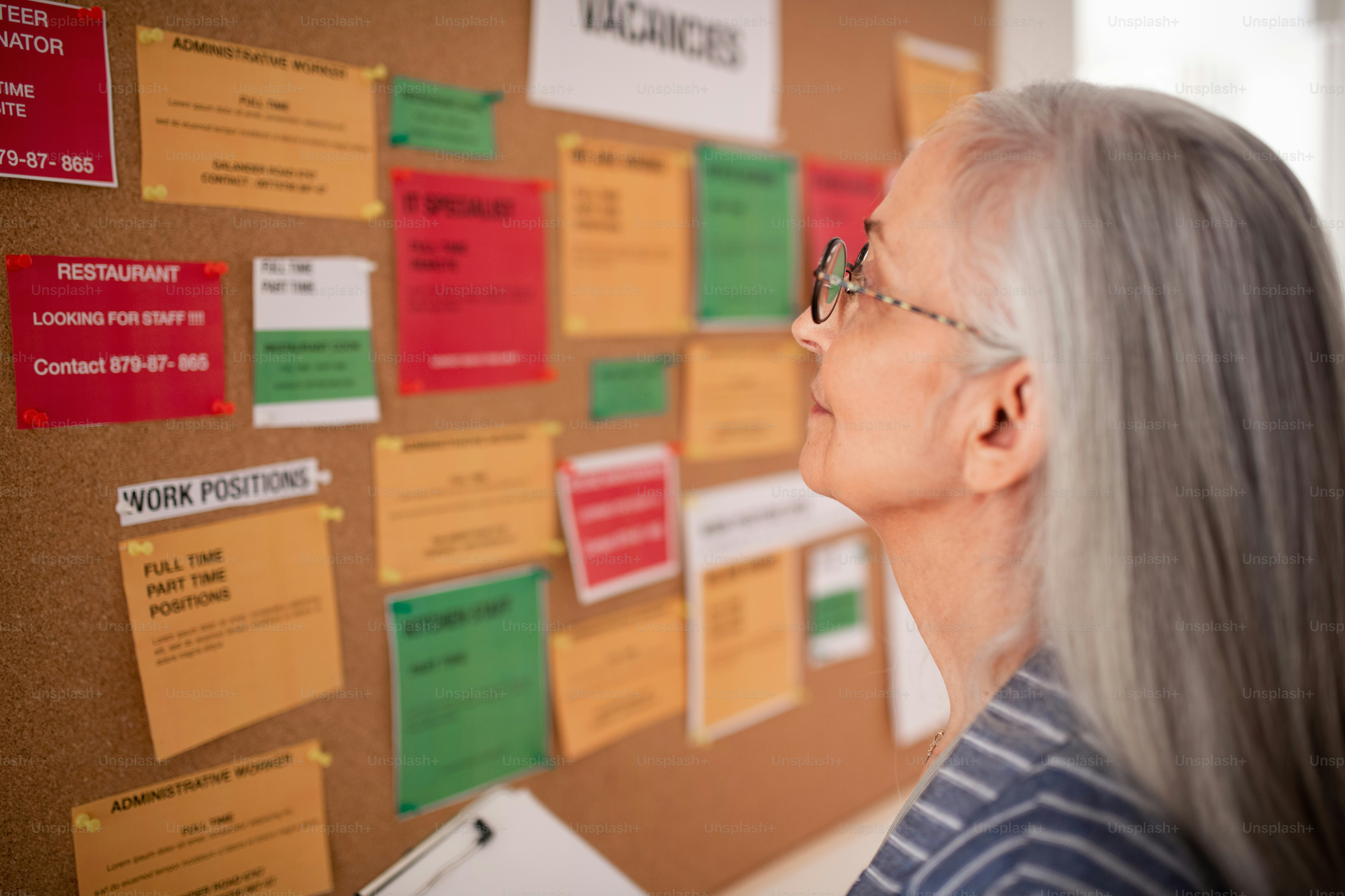 A job center employee with file form standing in front of employment