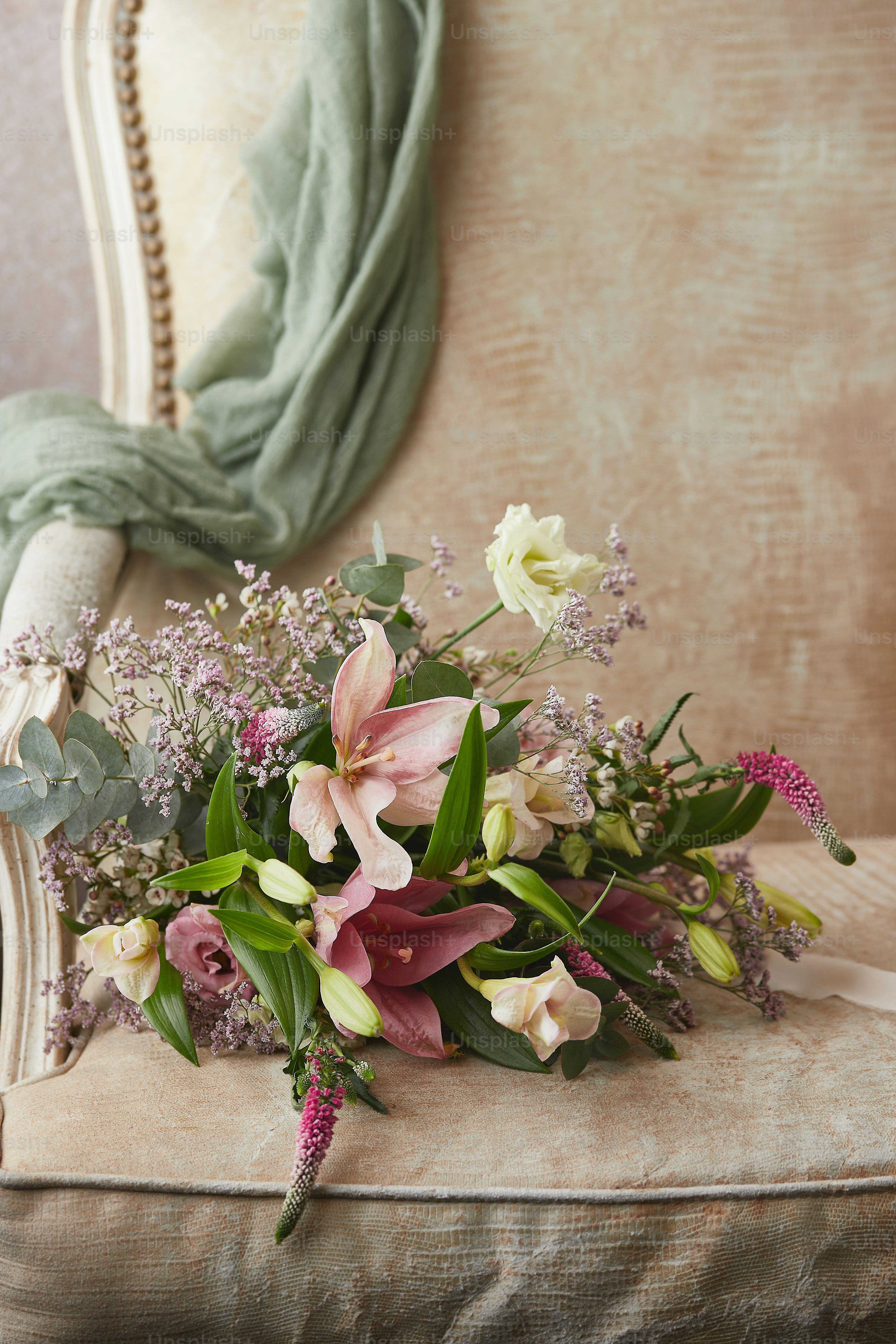 A bouquet of flowers sitting on top of a chair photo Wedding flower