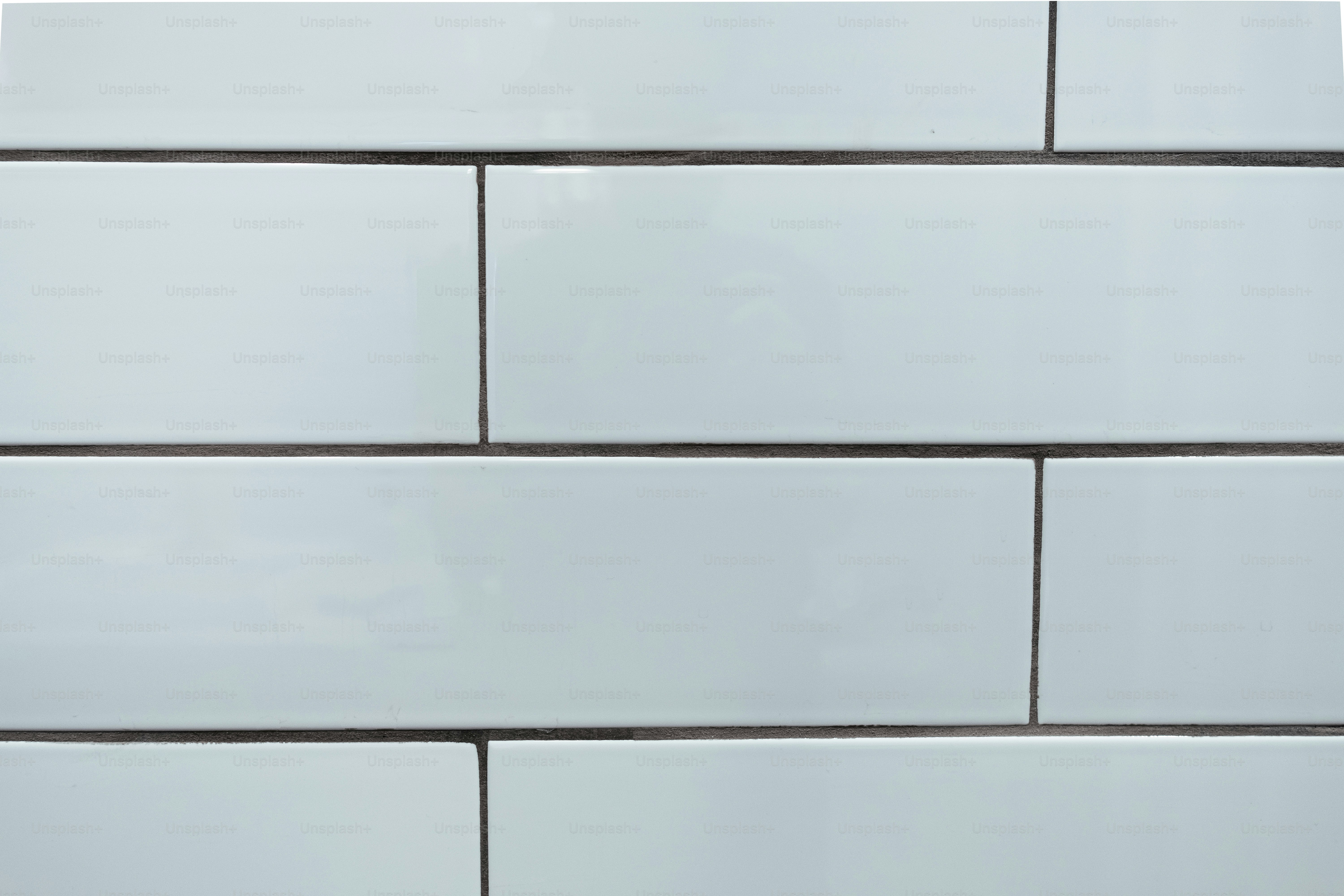 A close up of a white brick wall photo Tiles Image on Unsplash