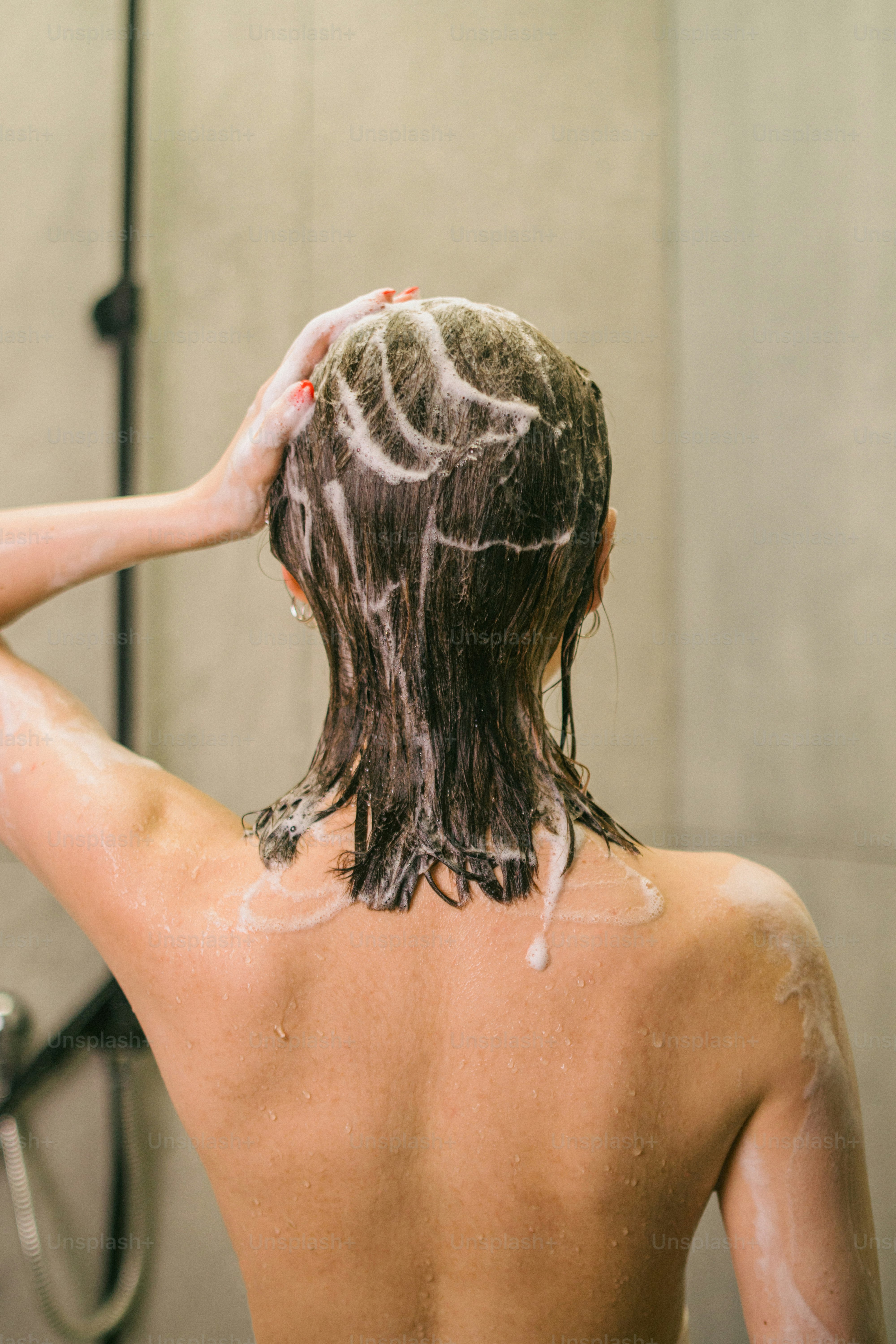 A person with a lot of hair in a shower photo Shampoo Image on Unsplash