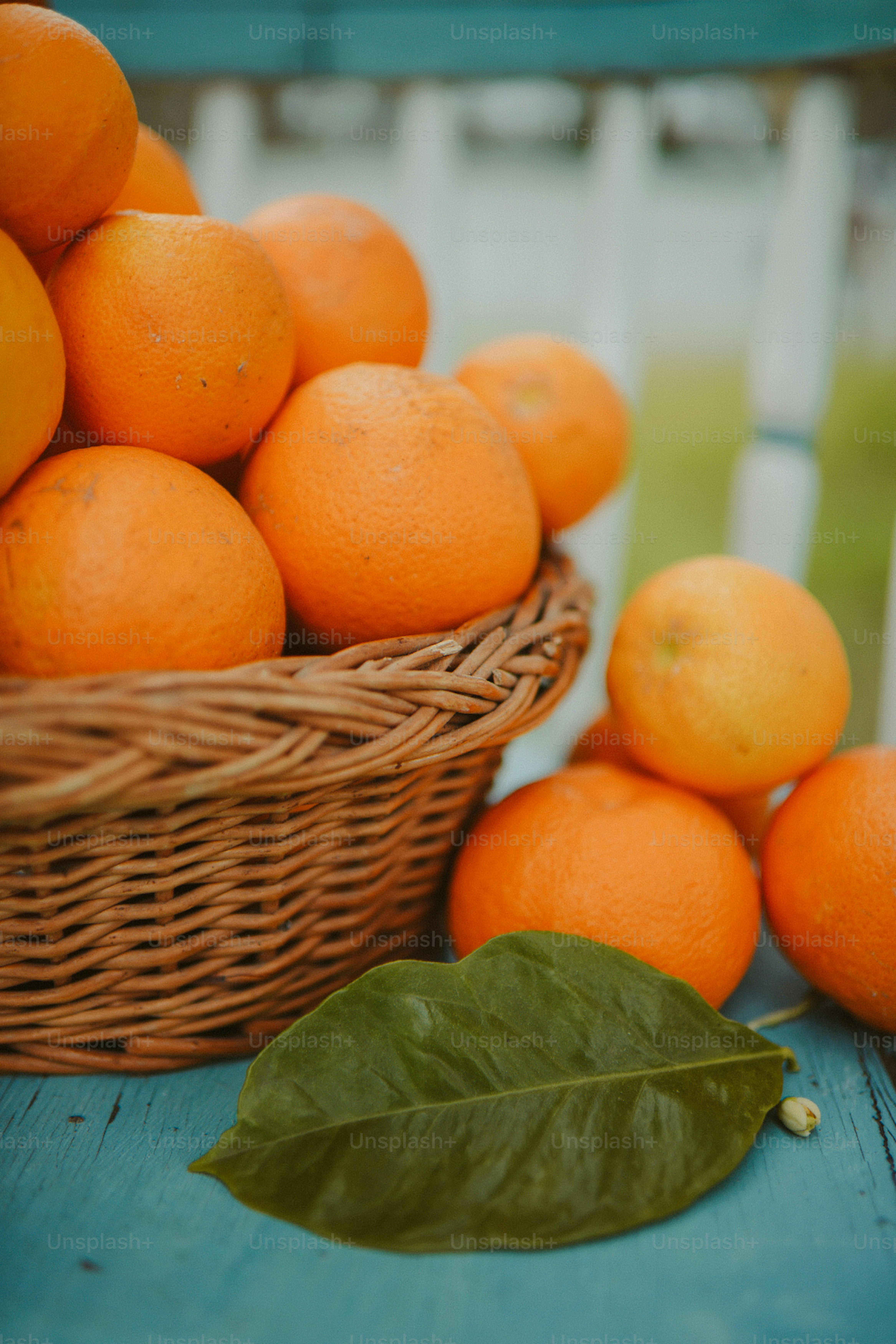 A basket full of oranges sitting on a table photo Fruits Image on