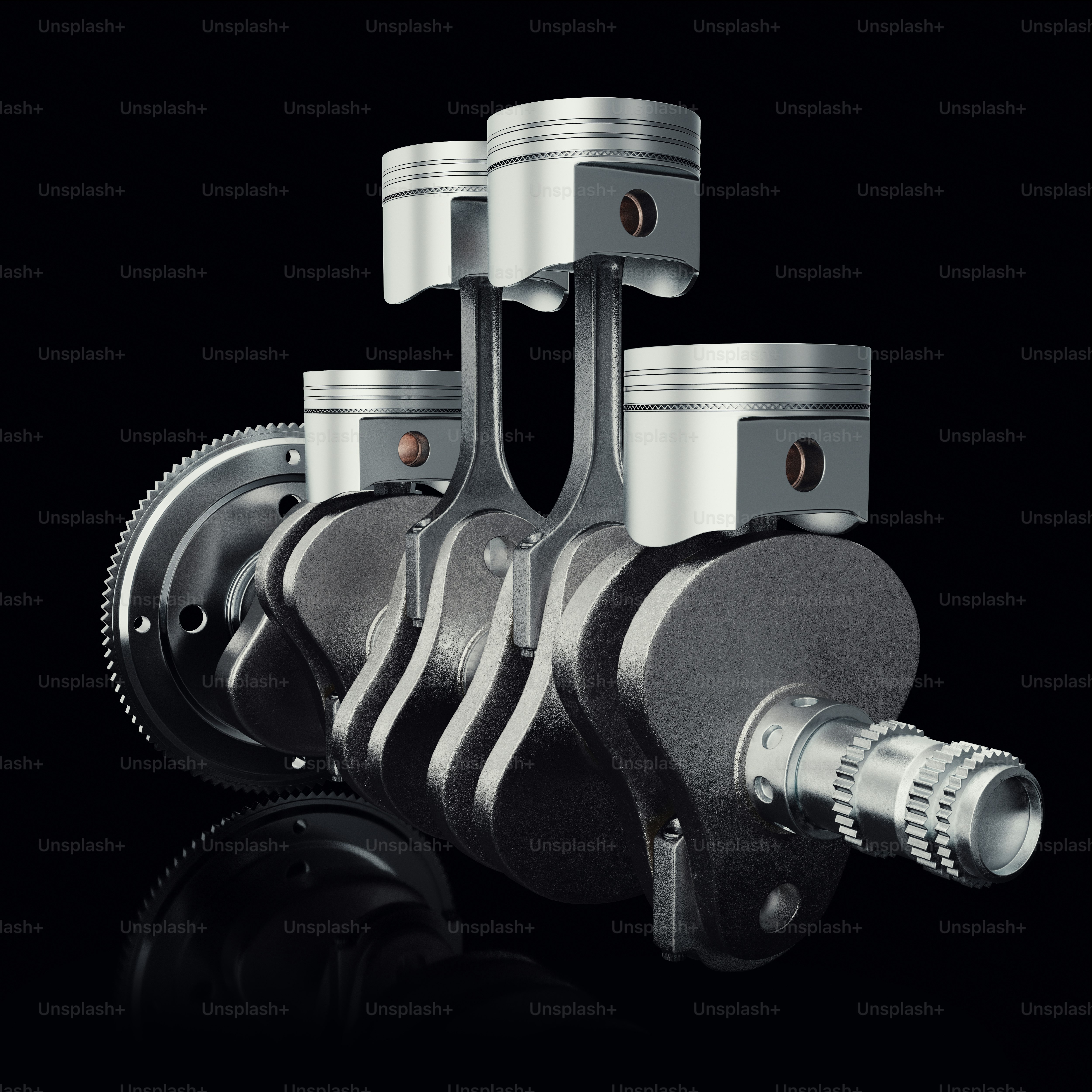 V4 engine pistons and cog on black background. Pistons and crankshaft