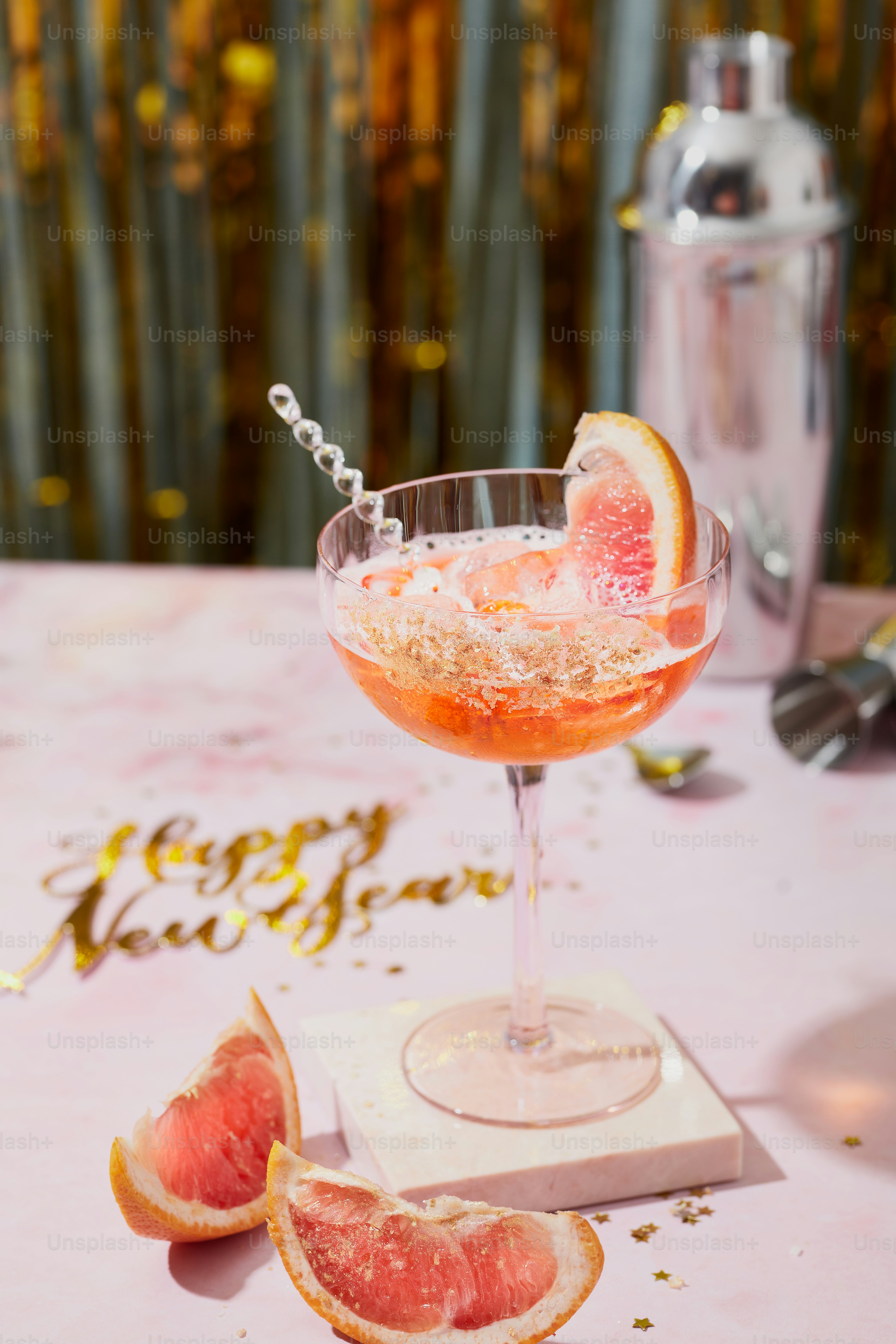 A grapefruit cocktail garnished with a grapefruit garnish photo