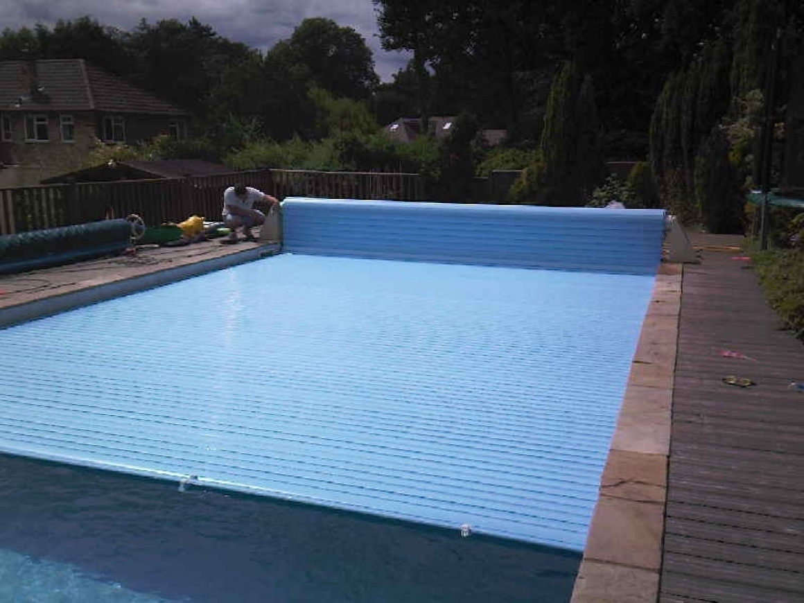 Swimming pool safety covers, slatted pool covers
