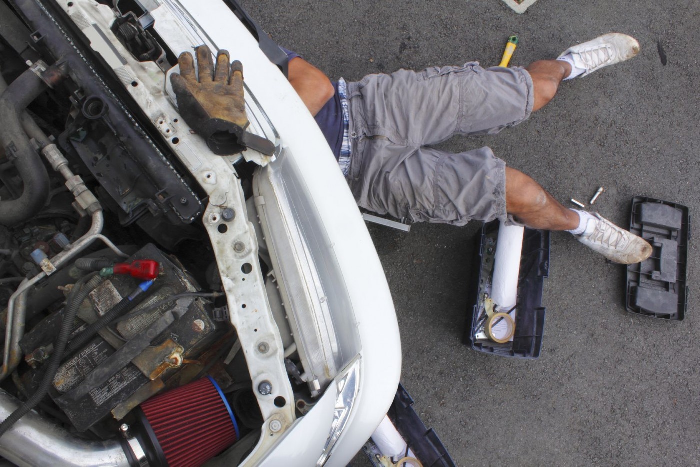 He is Mending his car