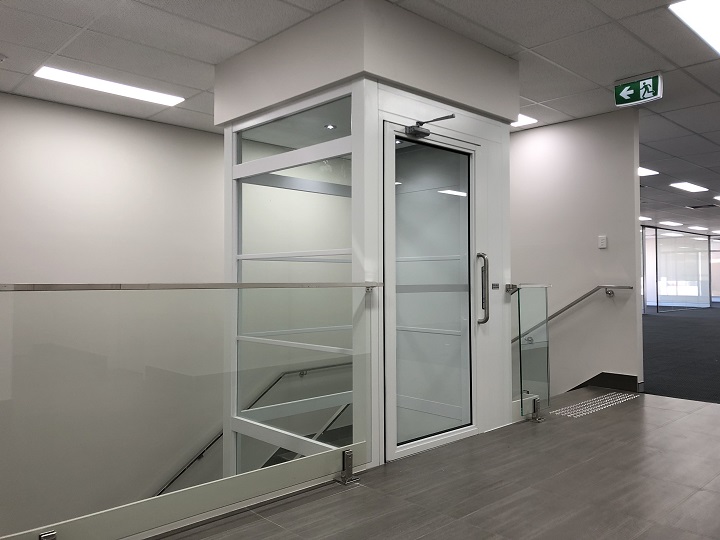 Full Glass Enclosure Lift For This Office Space P. R. King & Sons