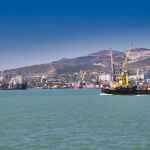 a yellow tugboat sailing