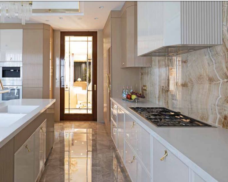 A Luxury Kitchen Where Gold and Coral Create a Stunning Environment