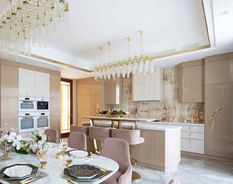 A Luxury Kitchen Where Gold and Coral Create a Stunning Environment