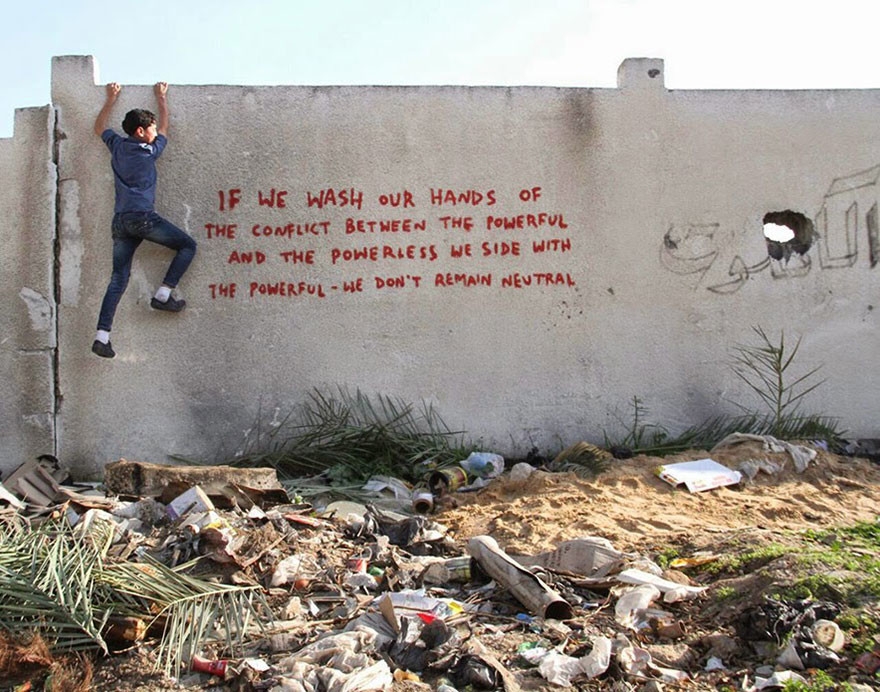 Street Artist Sneaks Into Gaza To Create Haunting Murals In The Ruins