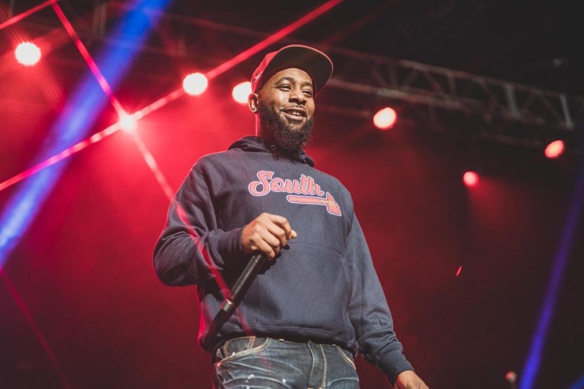 Karlous Miller eaaring a blue jacket and red cp(026)