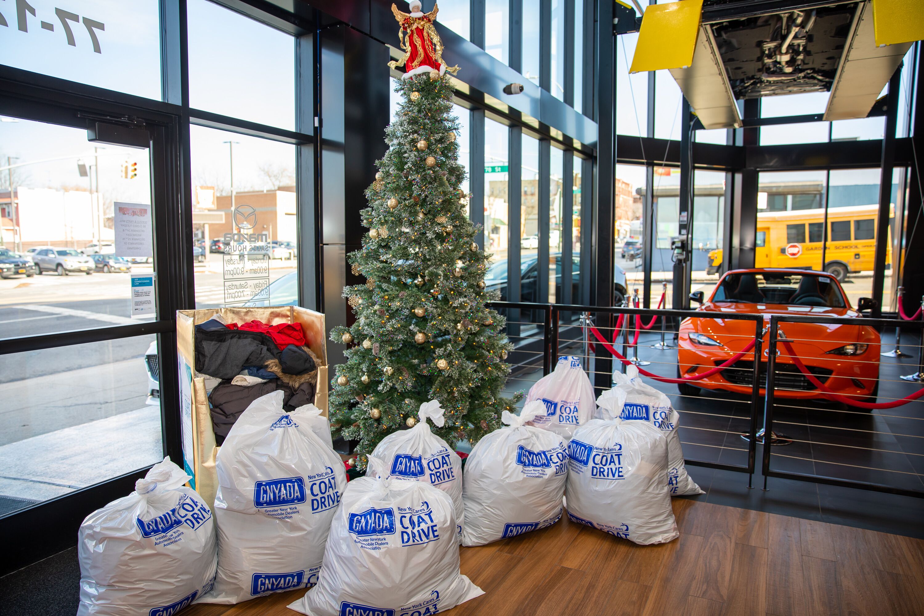 Queens car dealerships collect thousands of coats for New York Cares Coat Drive