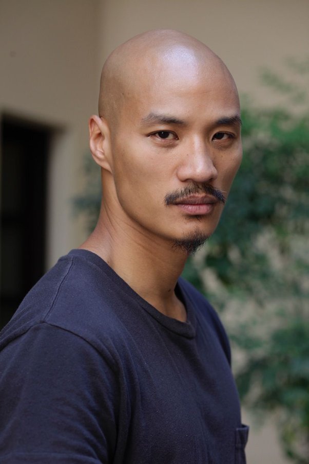 Do women generally find a bald head less attractive on a White or Asian