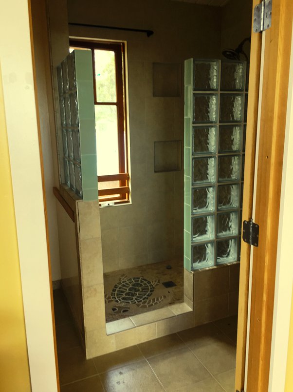 Is it legal to have a wooden window sill in the shower? My apartment