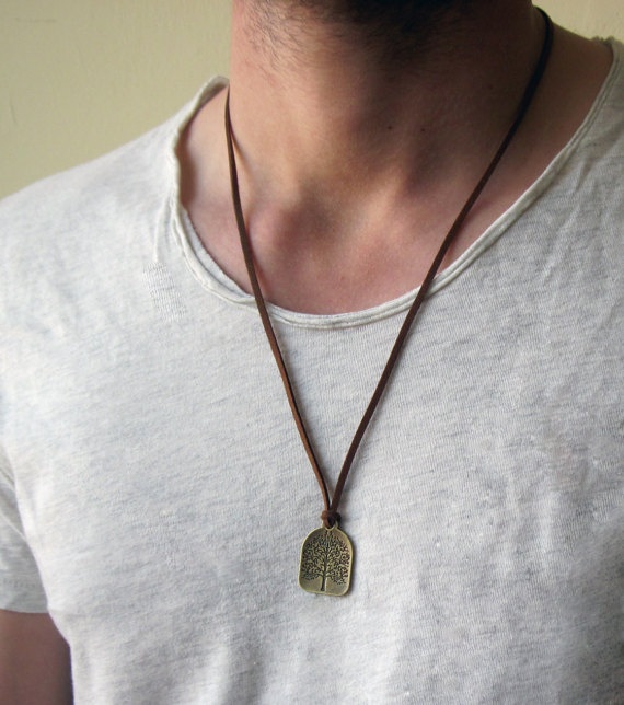 Should a male wear a necklace pendant above or under their shirt? Quora