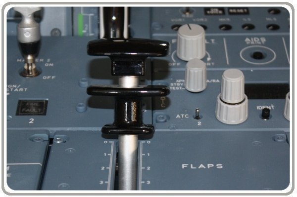 What is the device that airplane pilots use to control the flaps on the