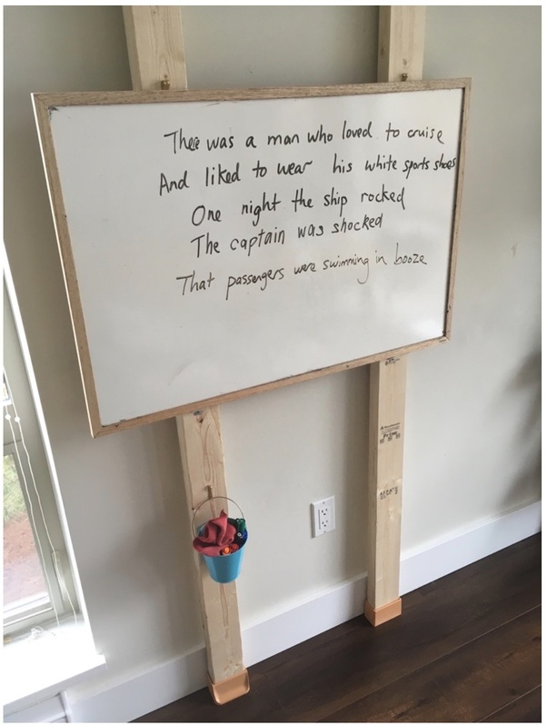 What is the best way to stick a heavy white board without drilling the