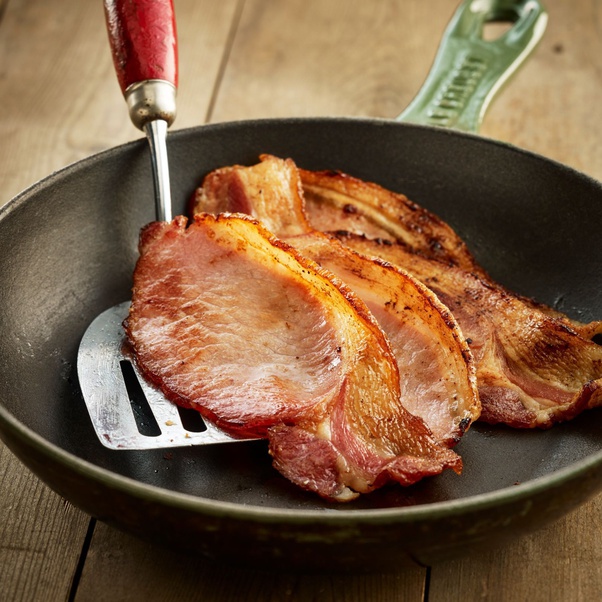 Why does adding water to the frying pan make bacon turn out better? Quora