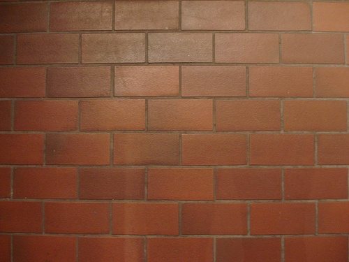 What are the pros and cons of hollow cement block building construction