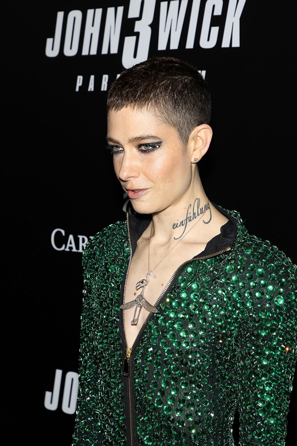 What does Asia Kate Dillon's (adjudicator on John Wick 3) neck tattoo