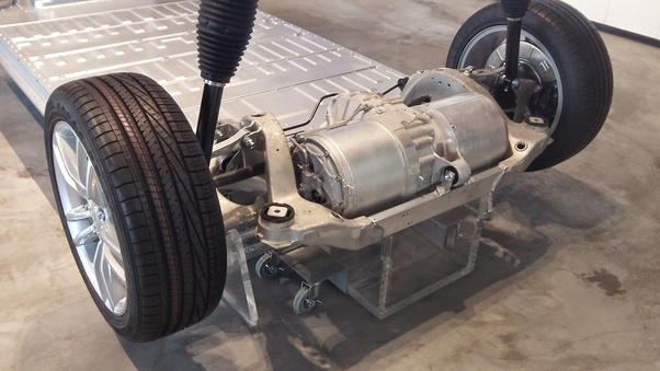 Why is the chassis design of Tesla car different from other regular