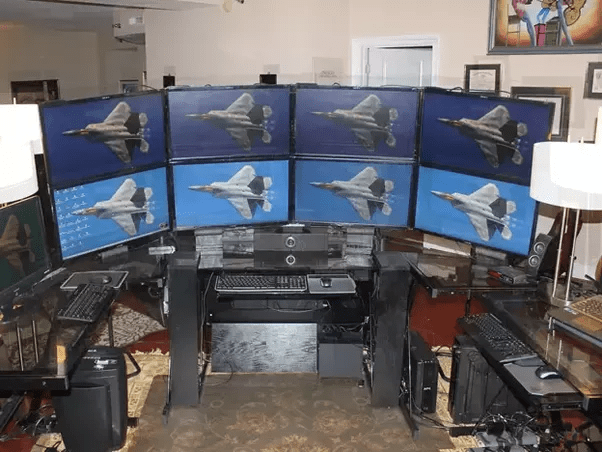 Why do PC Gamers have 2 or 3 monitors? Besides how are they synced to