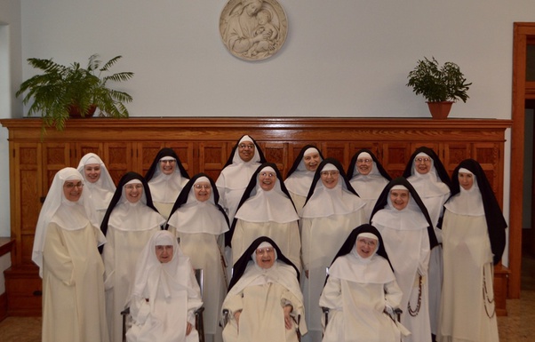Why do some nuns wear just a white veil, while other nuns wear a black