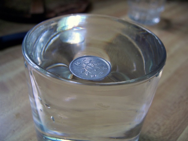 How does a One Yen coin float on the surface of the water? Quora