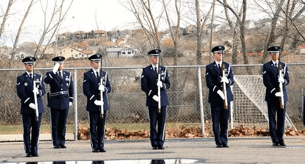 When soldier stands on guard and has to salute, what does he/she do