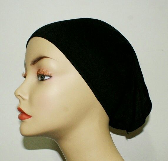 How do Muslim females wear their hair underneath the hijab