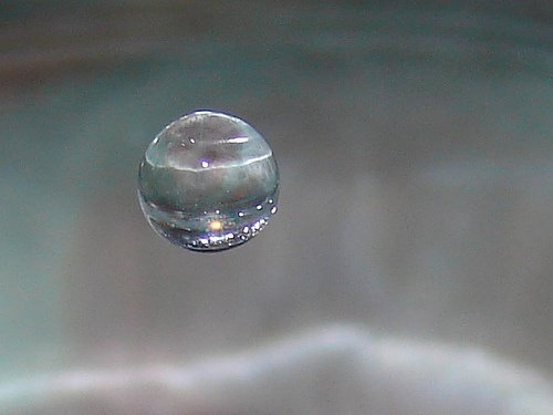 Why does a drop of water form a spherical shape on a flat surface? Quora