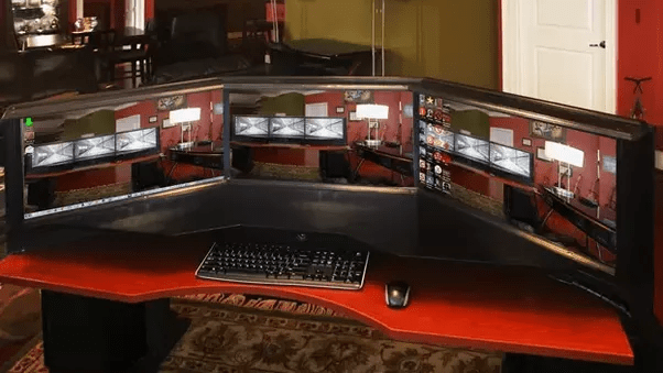 Why do PC Gamers have 2 or 3 monitors? Besides how are they synced to