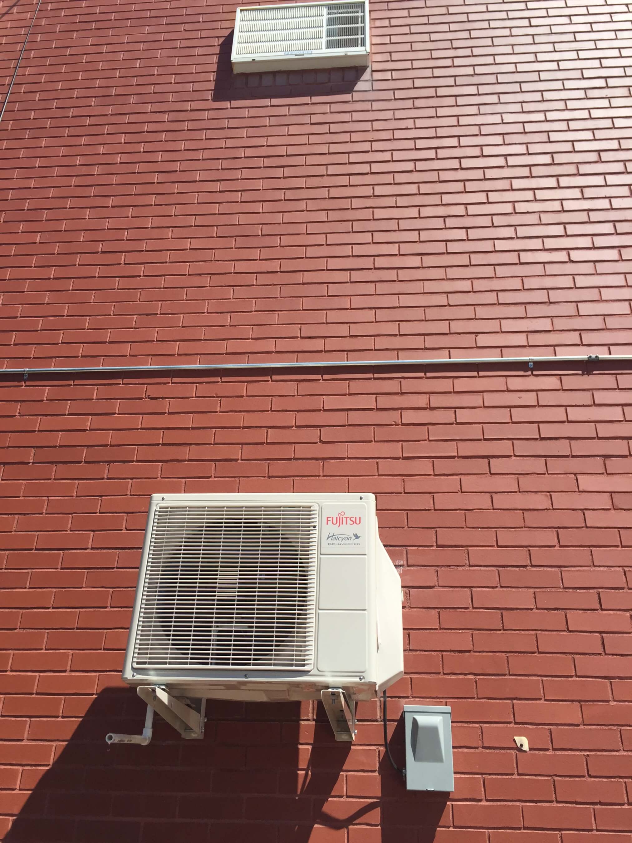 Before and AfterOutside view of installation Queens Ductless Air