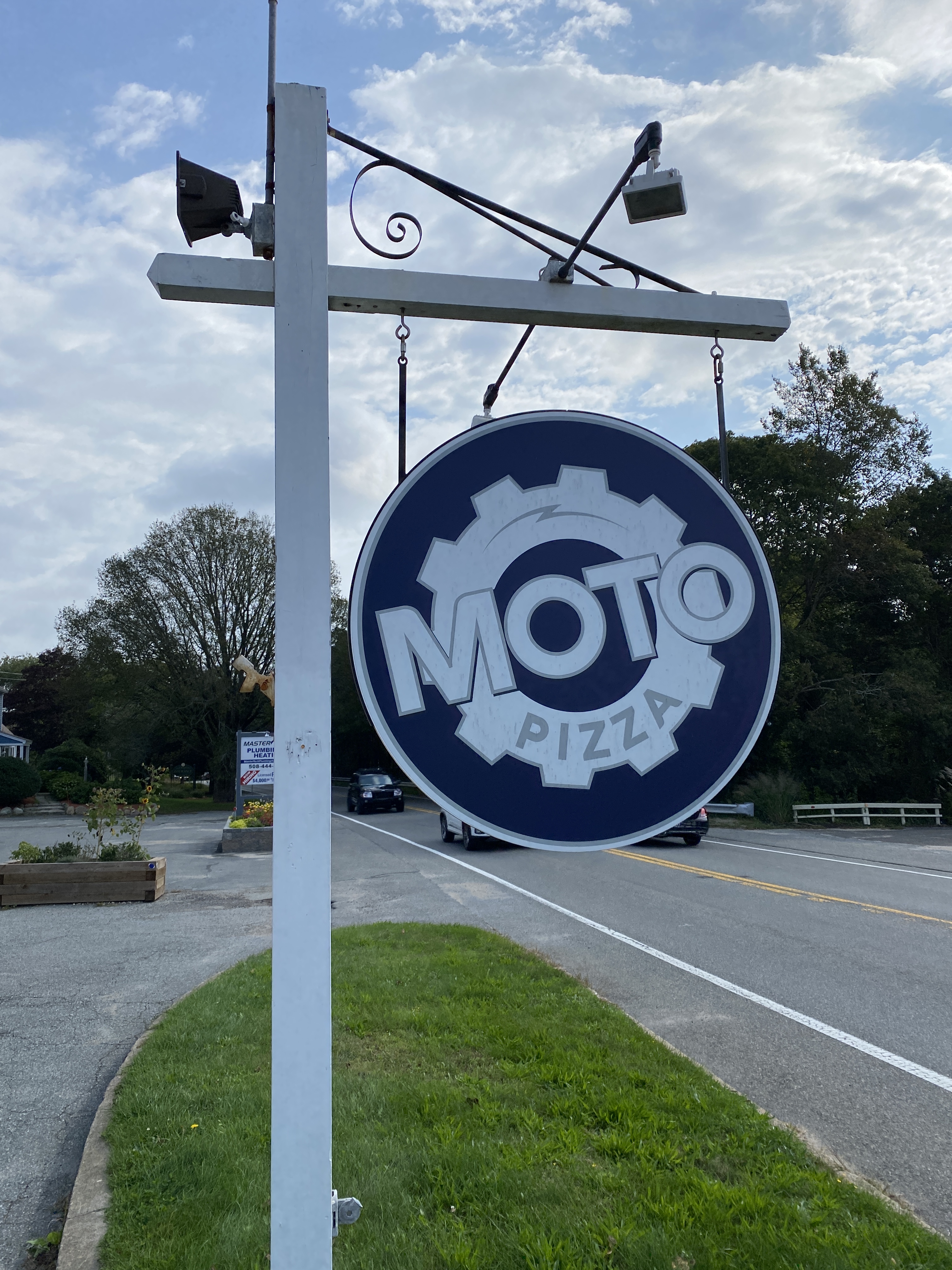 Moto Pizza sign next to road
