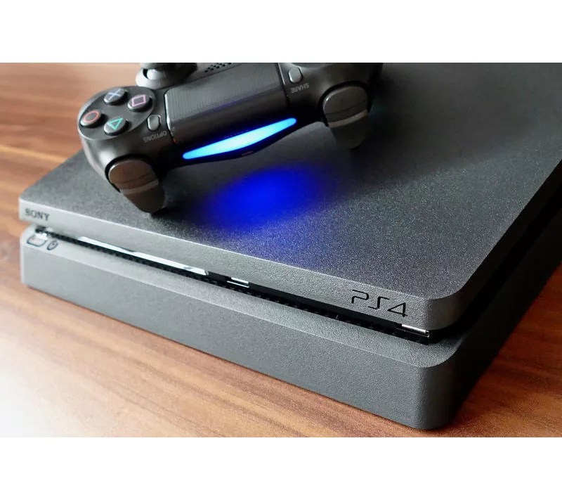 PlayStation 4 Slim 1TB with Madden 21, The Last of Us, and Accessories