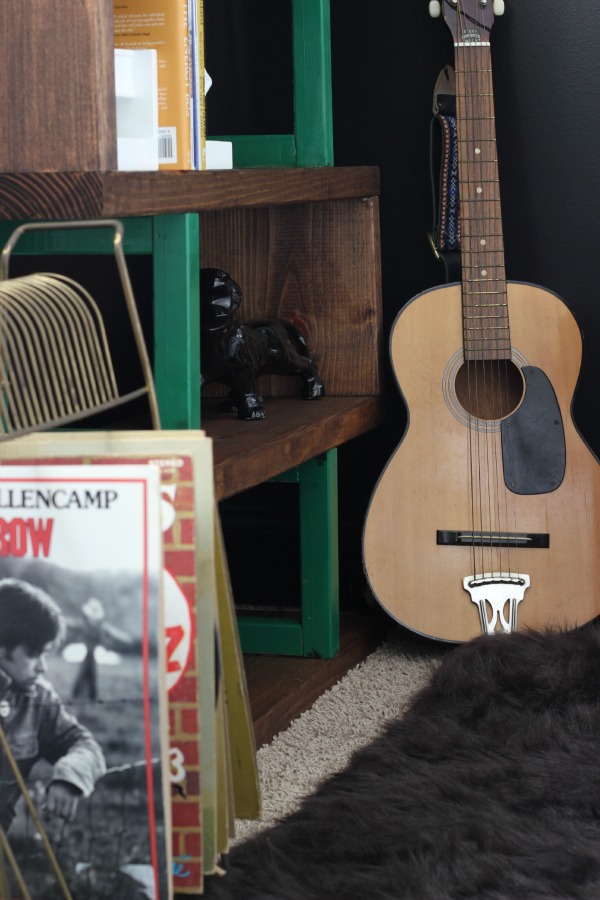 DIY Rustic Modern Bookshelf Build - guitar beside bookshelf - Rain on a Tin Roof