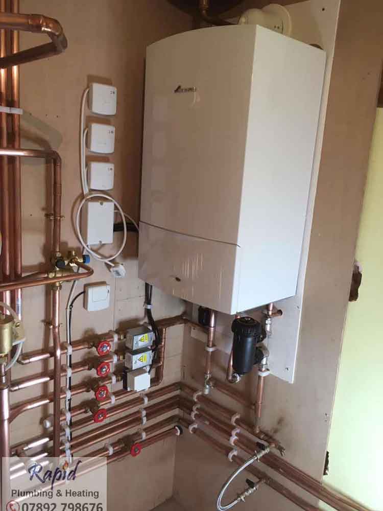 System Boiler With An Unvented Hot Water Cylinder & Honeywell Evohome