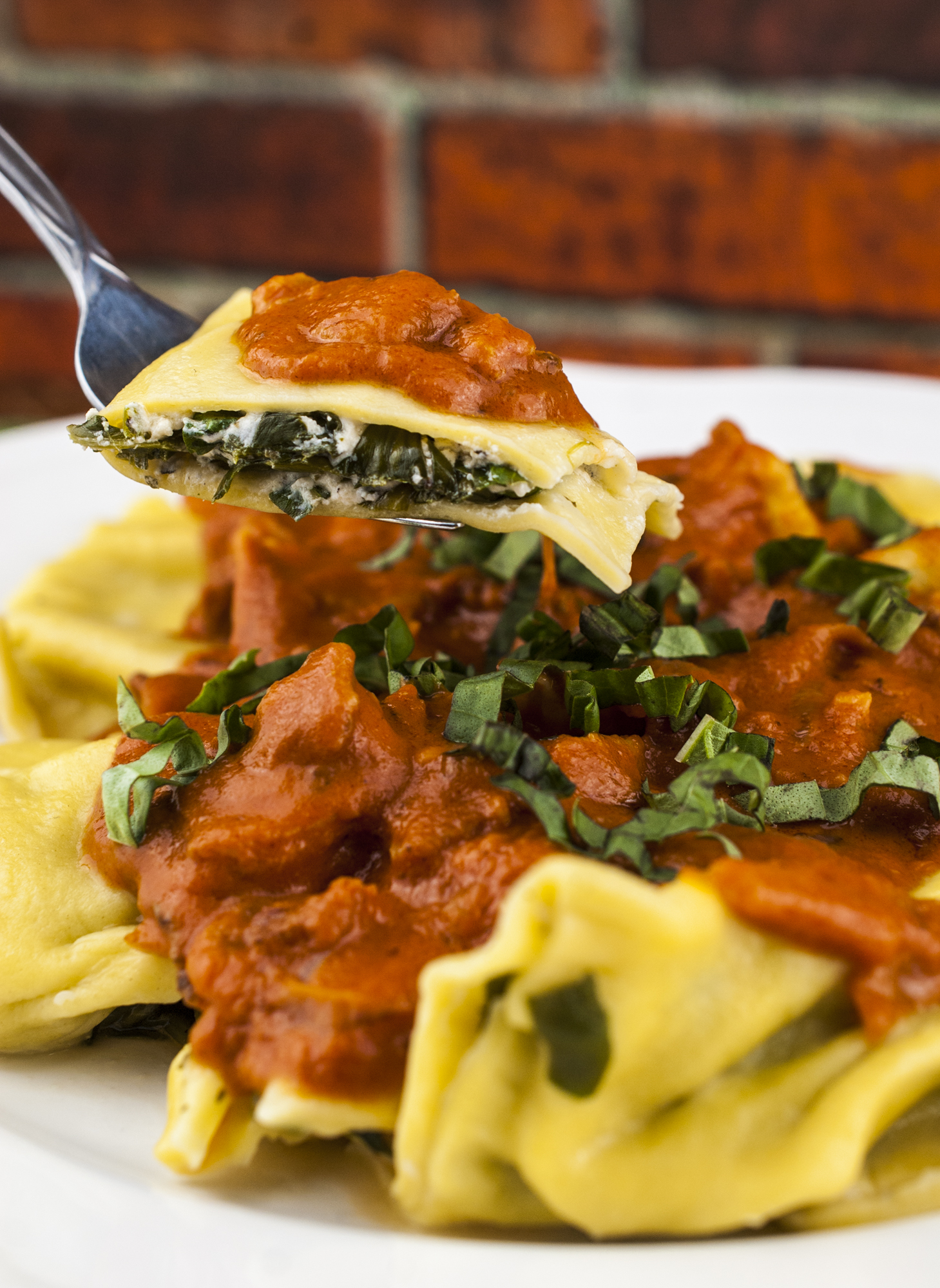 Spinach and Goat Cheese Ravioli in Rosé Sauce with Bacon and Vidalia