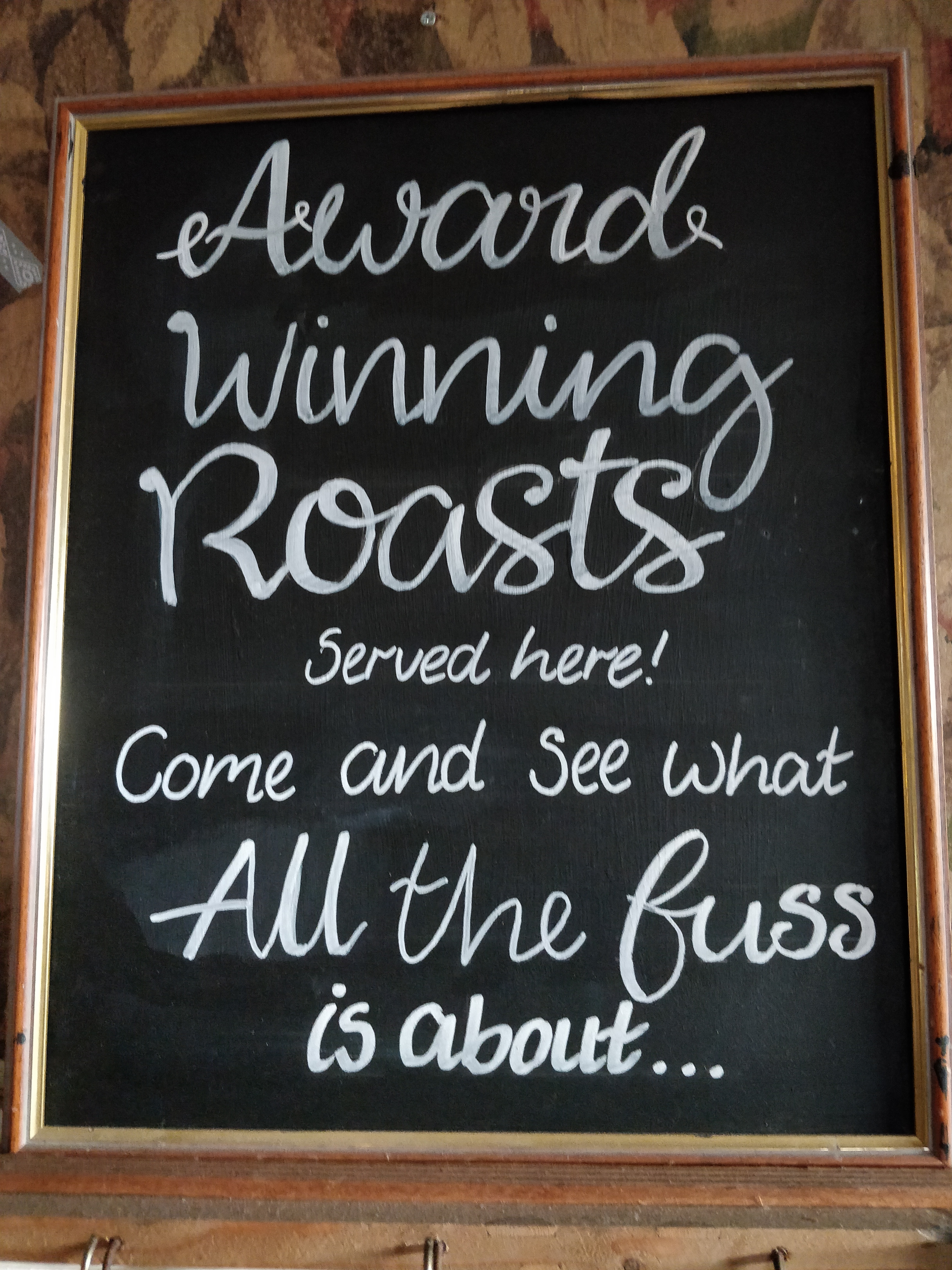 Sign of "award winning roasts"