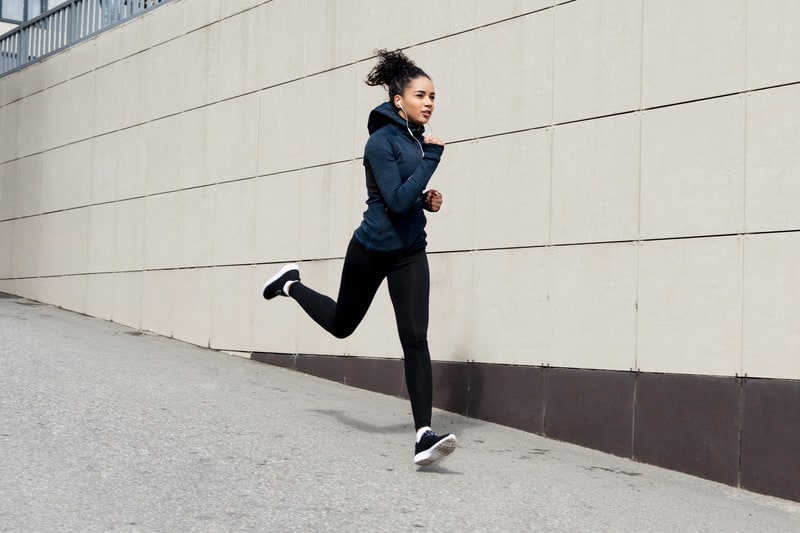 Marathon runners love their headphones, but is it the best choice