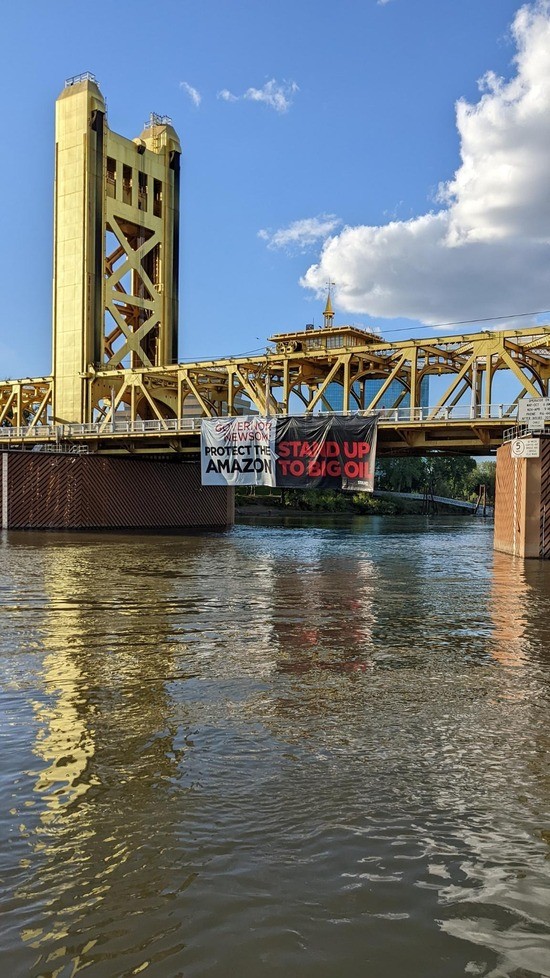 Amazon Watch and Stand.earth deploy 75foot banner demanding California