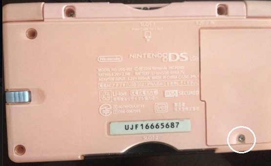 Take out the battery pack. insert the end of the screwdriver into the