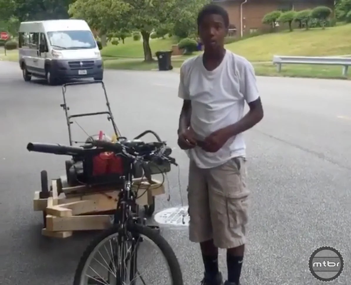 Teenager builds bicycle trailer, founds lawn mowing empire