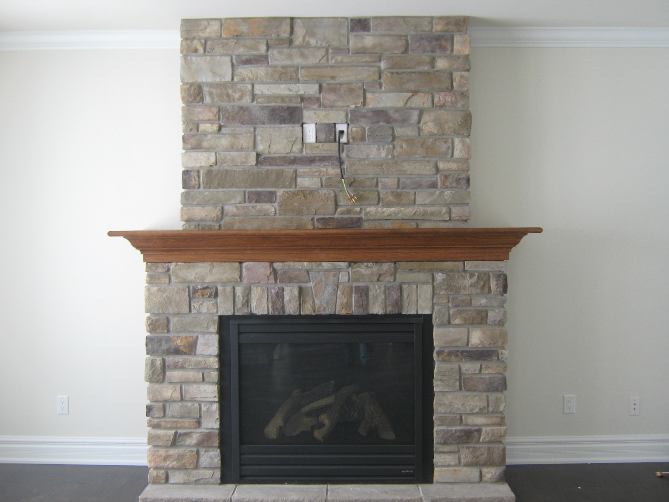 Custom fireplace with “Country Ledge Stone” Rick