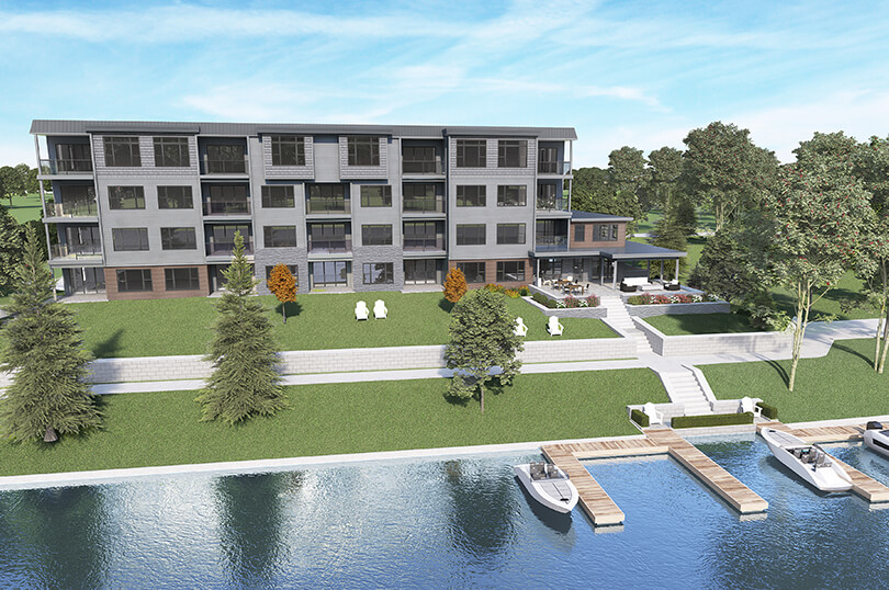 Riverside view of River’s Edge Bracebridge condos with boat dock and slips