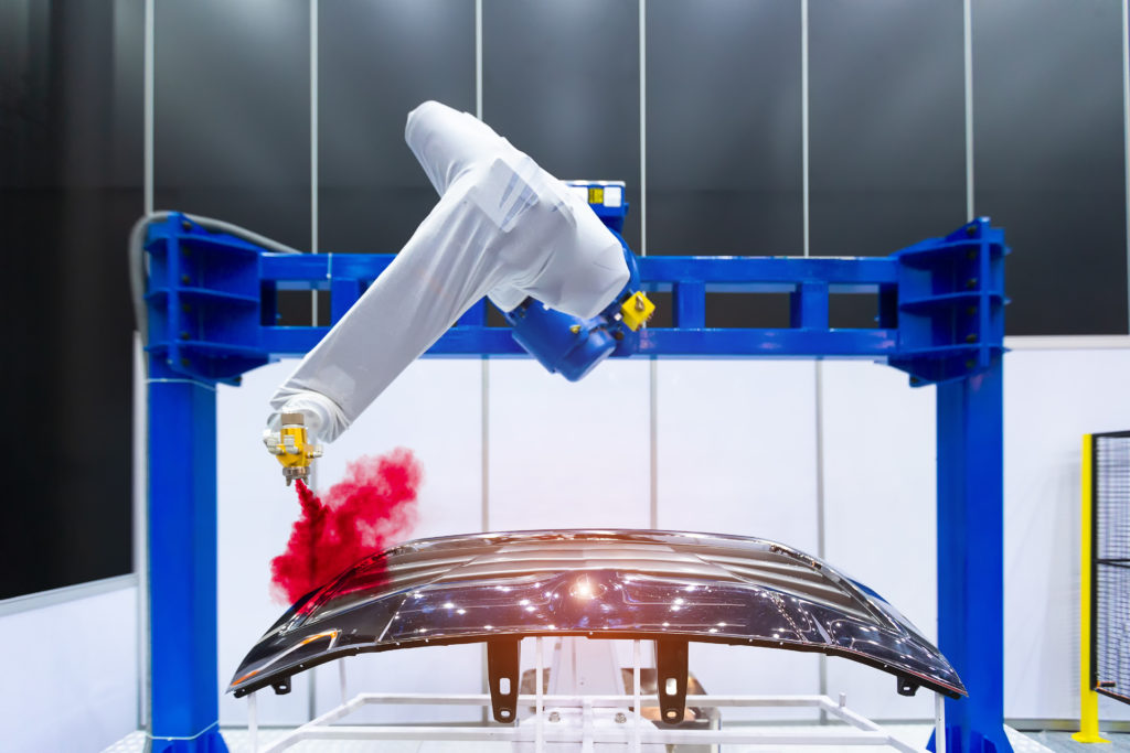 Robotic arm painting spray to the automotive part. Hightechnology